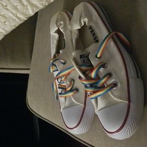 Converse all stars slip on of wear them behind the ankle.